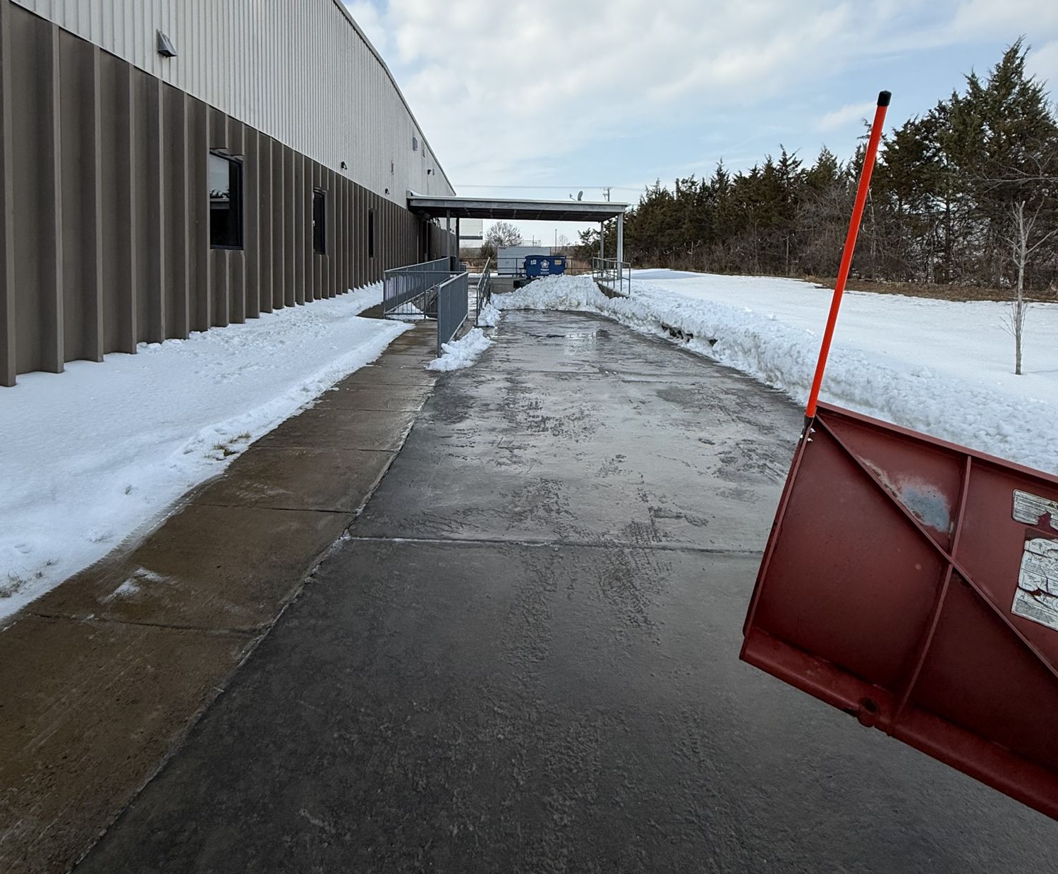 Cleared service drive and walk at a commercial building